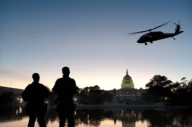 Soldiers Provide Homeland Security at Capitol Hill Soldiers guard Capitol Hill as a helicopter patrols the air. Grab the separate elements here: department of homeland security stock pictures, royalty-free photos & images