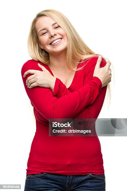 Happy Young Woman Hugging Herself Stock Photo - Download Image Now - Embracing, Individuality, Looking At Camera
