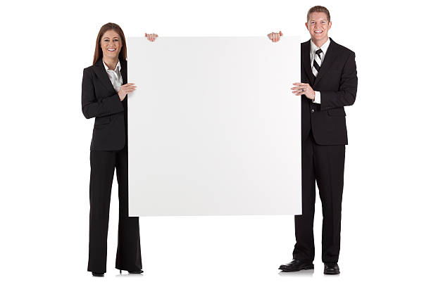 istock Business couple holding a placard 184856641