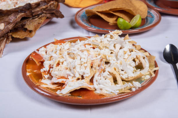 istock Mexican clay plate with tostadas and green lemons 1848568531