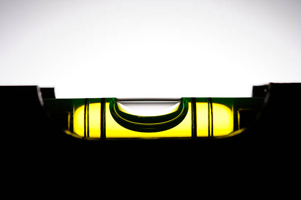 Silhouette of level against white background with copy space.