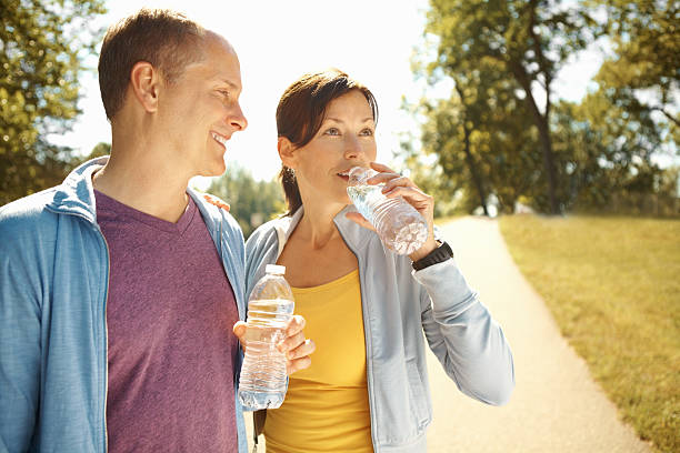 istock Healthy couple drinking water 184856911