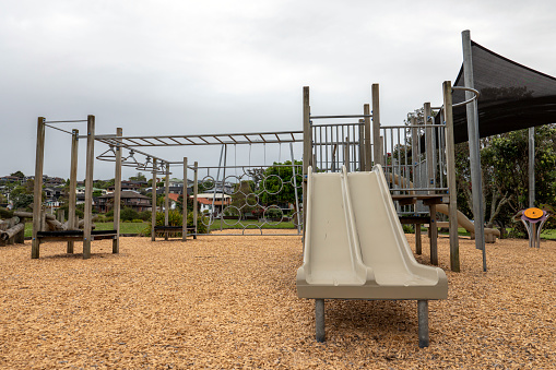 Abandoned dutch playground with play equipment. All these toy constructions can be used by children for playing outside.