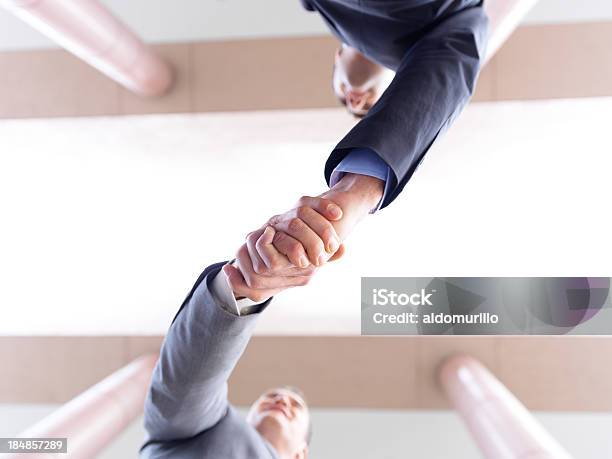 Business Men Shaking Hands After A Successful Deal Stock Photo - Download Image Now - 20-29 Years, 30-39 Years, Adult