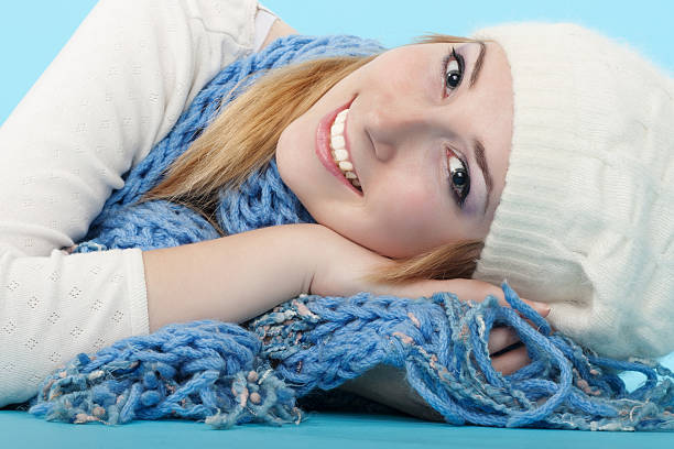 Happy young woman having fun in the snow