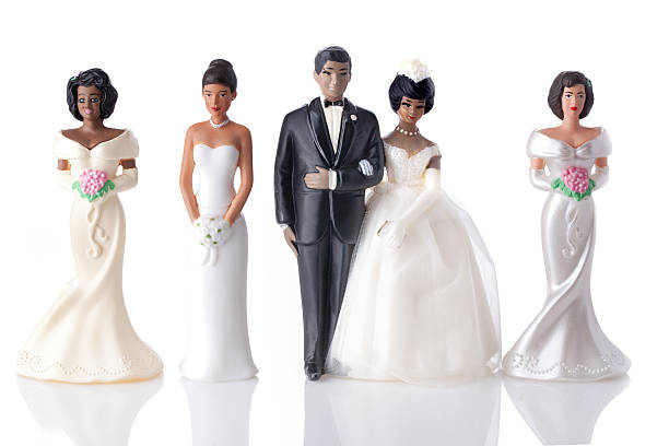 Wedding cake toppers - Polygamy stock photo