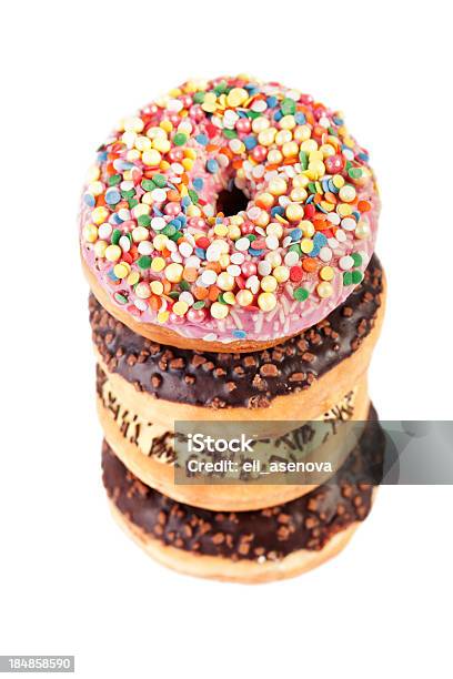 Pila De Cuatro Donuts Foto de stock y más banco de imágenes de Alcorza - Alcorza, Alimento, Amarillo - Color