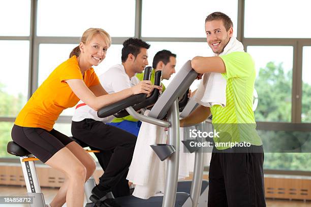 People Smiling In Gym Stock Photo - Download Image Now - Active Lifestyle, Adult, Bicycle