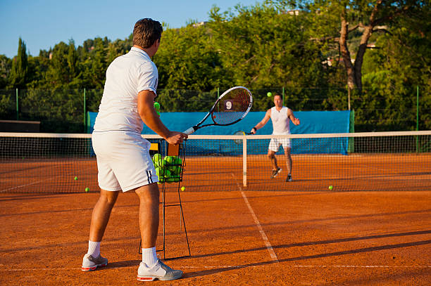 istock Tennis teacher giving lesson 184858780