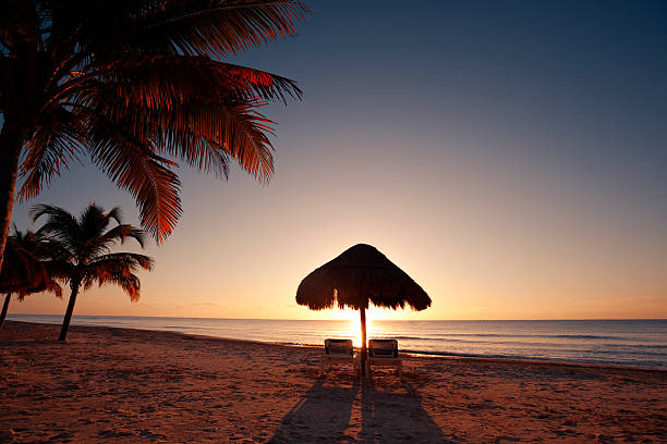 Tropical Beach Sunset in Vacation Resort Hotel of Cancun Mexico stock photo