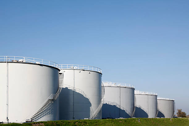 Oil tanks "Oil tanks in a row, Groot-Ammers, Netherlands" fuel storage tank photos stock pictures, royalty-free photos & images