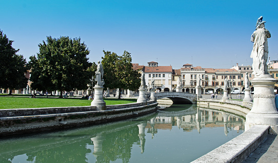 The canal running througha park in the city of Padua, Italy. It is located near the Basilica.