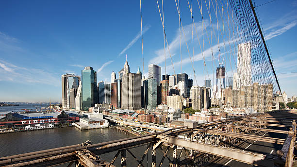 istock Lower Manhattan seen from Brooklyn bridge at sunrise 184859391