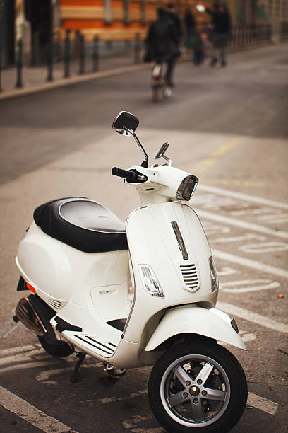 istock White scooter in the old city center 184859539