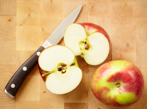Macintosh apples sliced on cutting board.Please see some similar images from my portfolio: