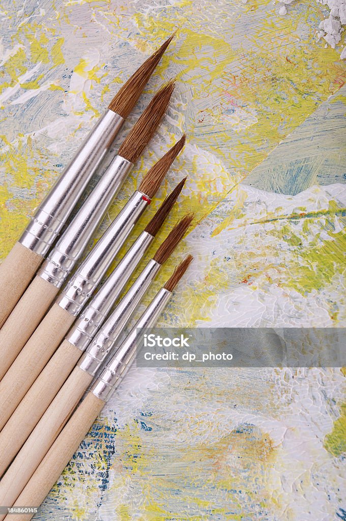 Paintbrushes New paintbrushes placed in a row on painting.Studio shot Art Stock Photo