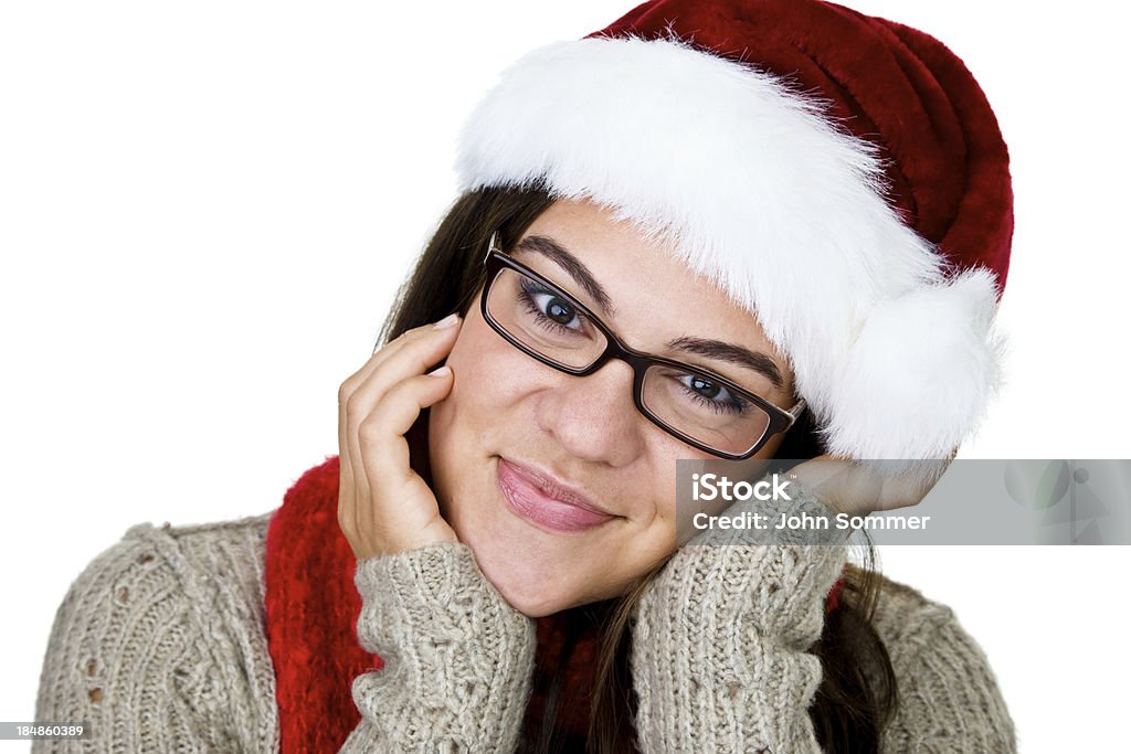 Christmas girl Cute girl wearing a Santa hat and isolated on white background  Beautiful Woman Stock Photo