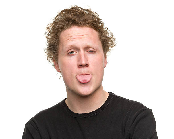 istock Young Man Sticks Out Tongue 184860464