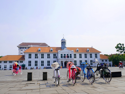Jakarta, indonesia - Dec. 6, 2023 :Fatahillah museum or Batavia history museum with antique bikes parked  located in kota tua (old city). the museum was built in 1707 - 1710 by Dutch government.