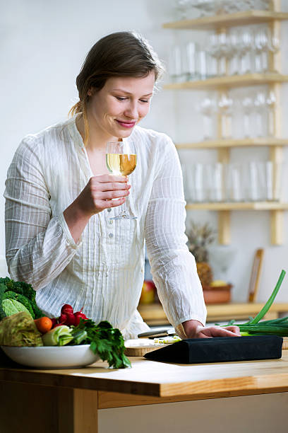 istock Young woman looking at a  Recipe online 184860812