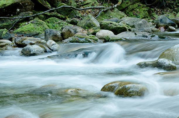 istock rocks in river spray and froth 184861080