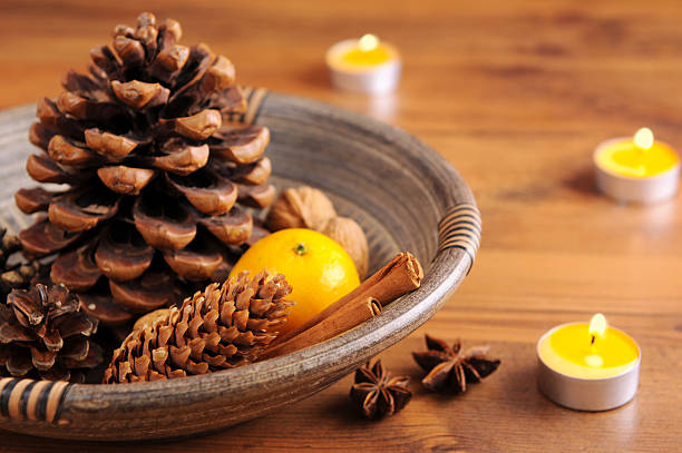 istock yellow tea light and natural Christmas decoration 184861425