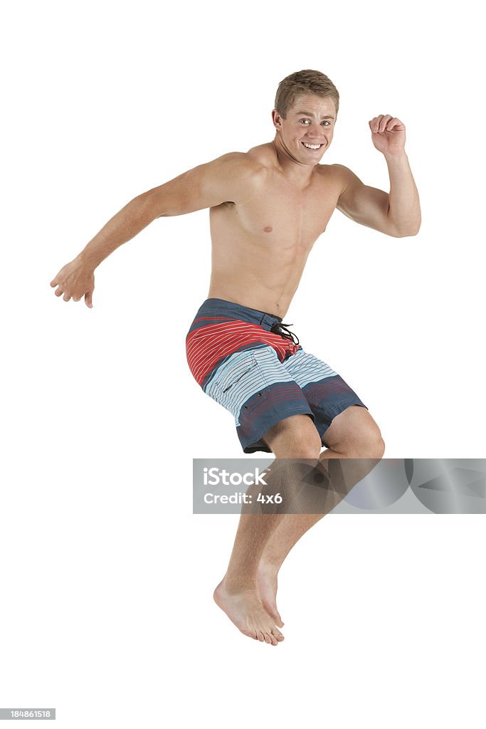 Uomo saltare - Foto stock royalty-free di A petto nudo