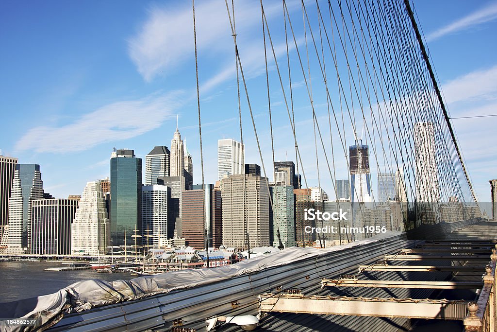 Manhattan cityscape seen from Brooklyn bridge "Manhattan cityscape seen from Brooklyn bridge, New York City, USA" Apartment Stock Photo