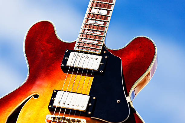 Heavenly strings: guitar close-up against blue sky