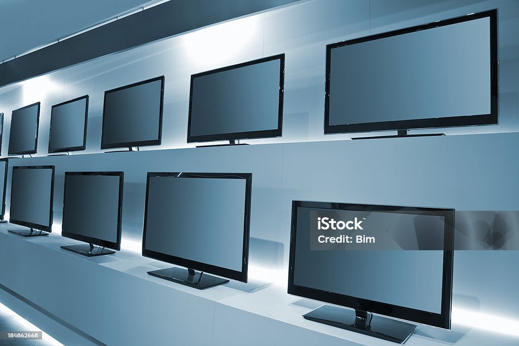 TV Store with rows of LDC TVs modern LCD TV screens, Television Set Stock Photo