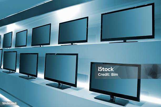 Tv Store With Rows Of Ldc Tvs Stock Photo - Download Image Now - Television Set, Store, Electronics Store