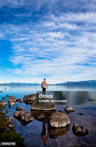 Man Looking At His Reflection In A Mountain Lake Stock Photo - Download Image Now - Bariloche, Argentina, Landscape - Scenery