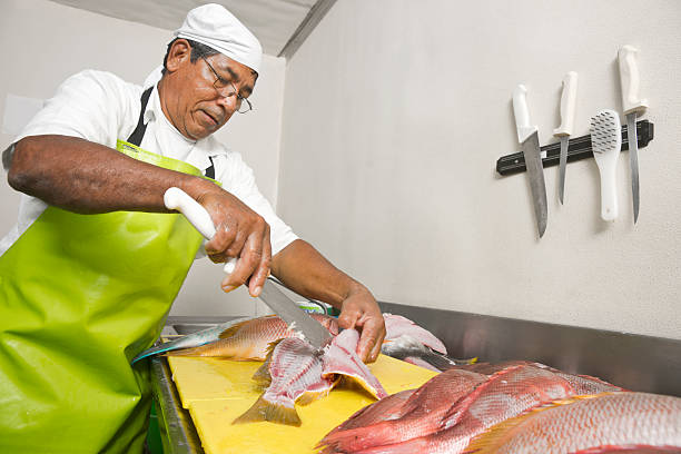 istock Fishmarket worker filleting red snapper 184862758