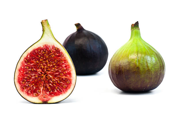 istock bisected and whole fig fruit isolated on white 184863069