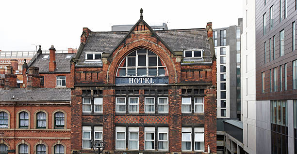 Old red brick hotel amongst modern buildings