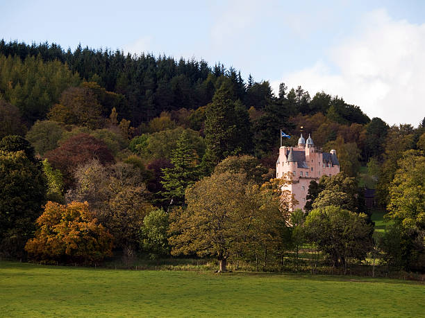 Craigievar Castle, Scotland Craigievar Castle in Aberdeenshire, Scotland, surrounded by trees in autumn colours. national trust photos stock pictures, royalty-free photos & images