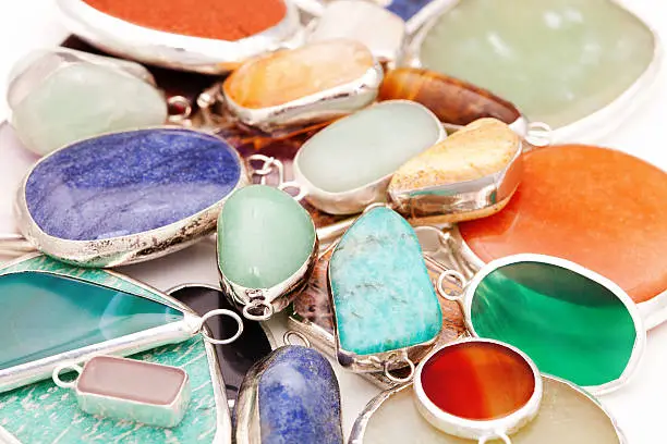 Pendants made of many different kind of colorful minerals and semi precious gems