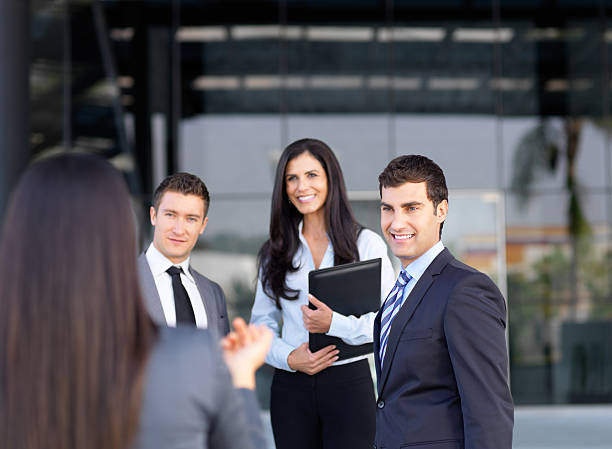istock Cheerful business team talking outside office 184863986