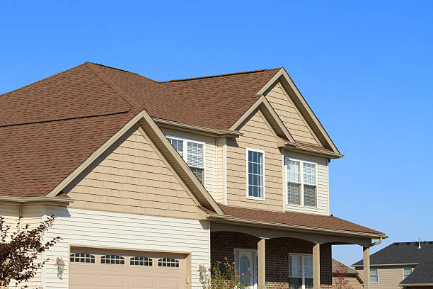 New home with vinyl siding and gutters stock photo