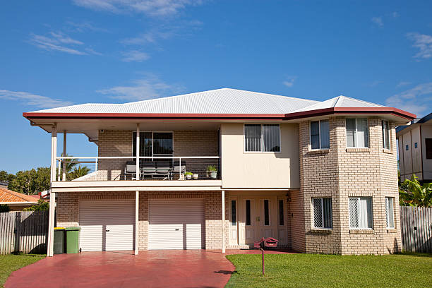 istock 1980’s Home Front two story blue sky 184864309