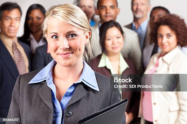 Confident Businesswoman In Front Of Diverse Business Team Stock Photo - Download Image Now