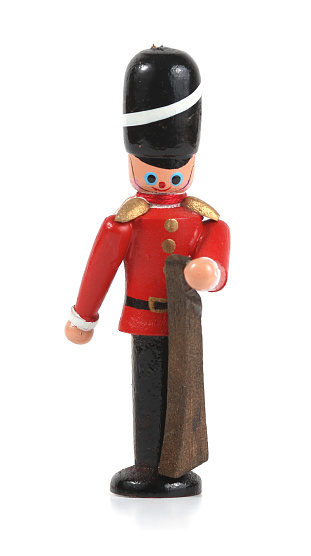 Nutcracker ornament isolated on white. Wooden, hand-painted christmas ornament.