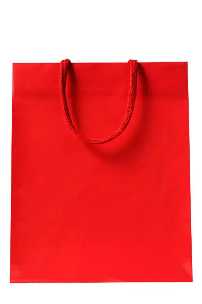 Photo of Isolated shot of blank red shopping bag on white background