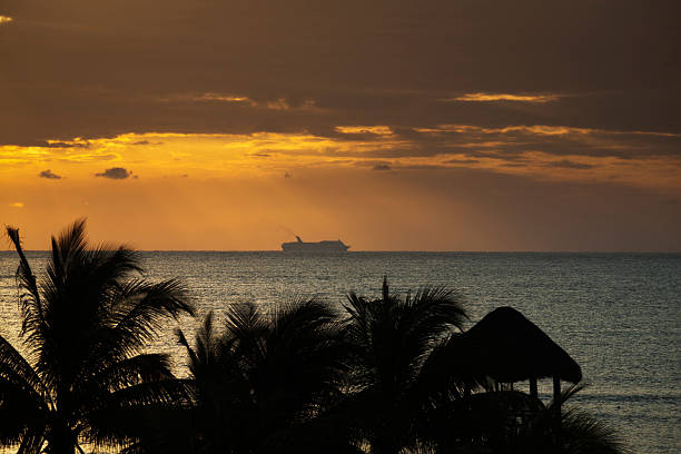 View from the promenade deck of a cruise ship at dusk.  Image was carefully shot so as not to reveal which ship is in the image