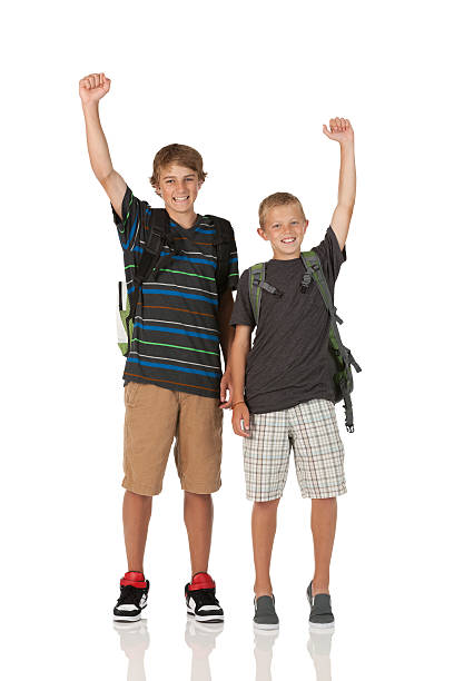 istock Twol brothers standing  together and cheering with raising hands 184864785