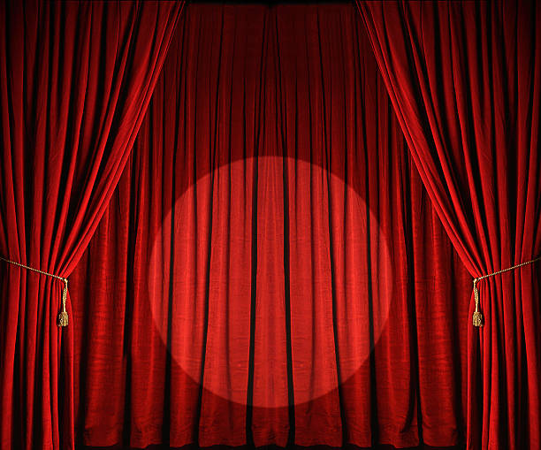 Large red theatre curtains with spotlight