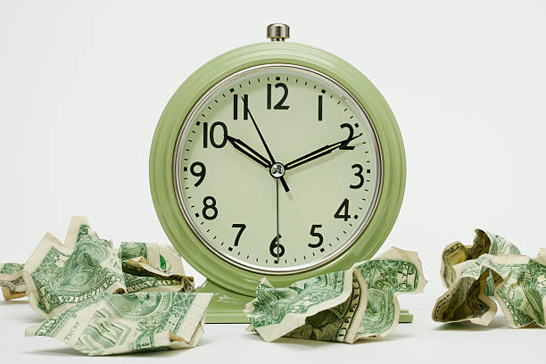 istock Alarm Clock and  American Dollar Bills 184865378