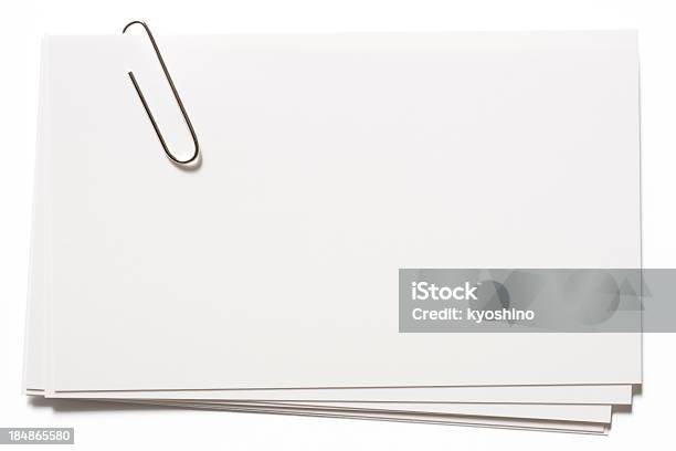 Stacked Blank White Cards With Paper Clip On White Background Stock Photo - Download Image Now