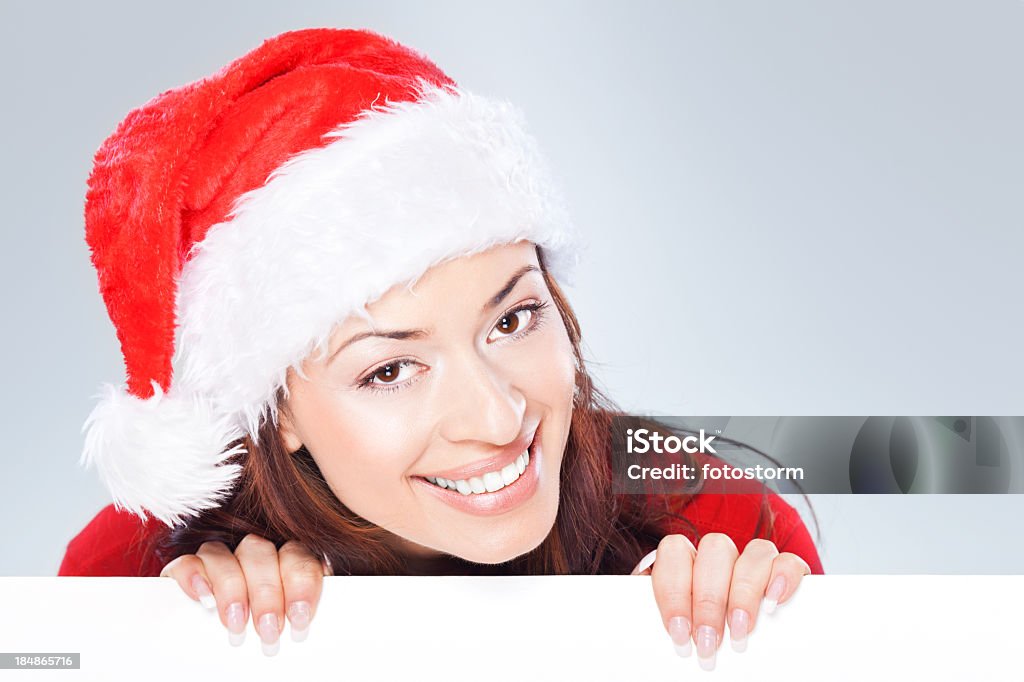 女性、クリスマス帽子を持つ空のバナー - 1人のロイヤリティフリーストックフォト