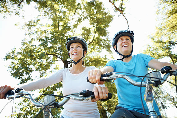 istock Mature couple cycling together 184865877